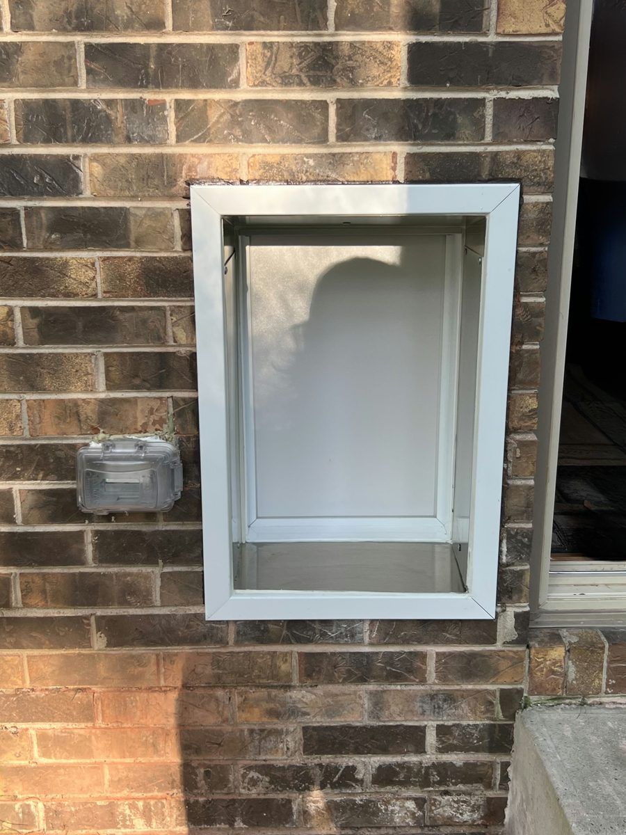 PlexiDor wall installation framed into brick exterior